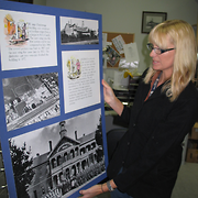 Sharon Guy, Heritage Worker, with Ballarat Orphanage Exhibition Board
